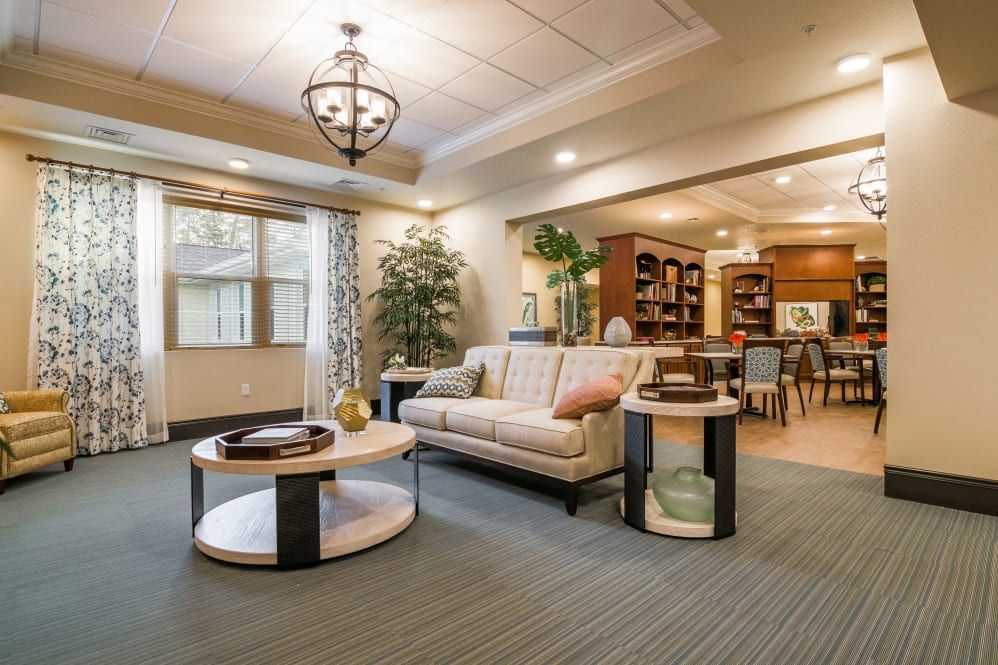 A spacious and elegantly designed living room with modern furnishings and an open floor plan.