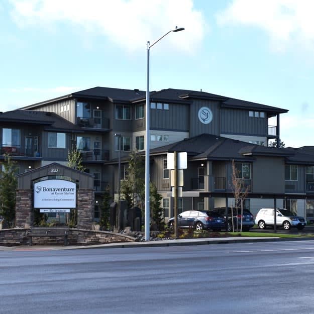 A modern apartment building located along a street.