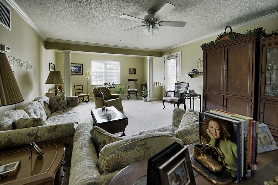A spacious living room with comfortable seating and elegant decor.