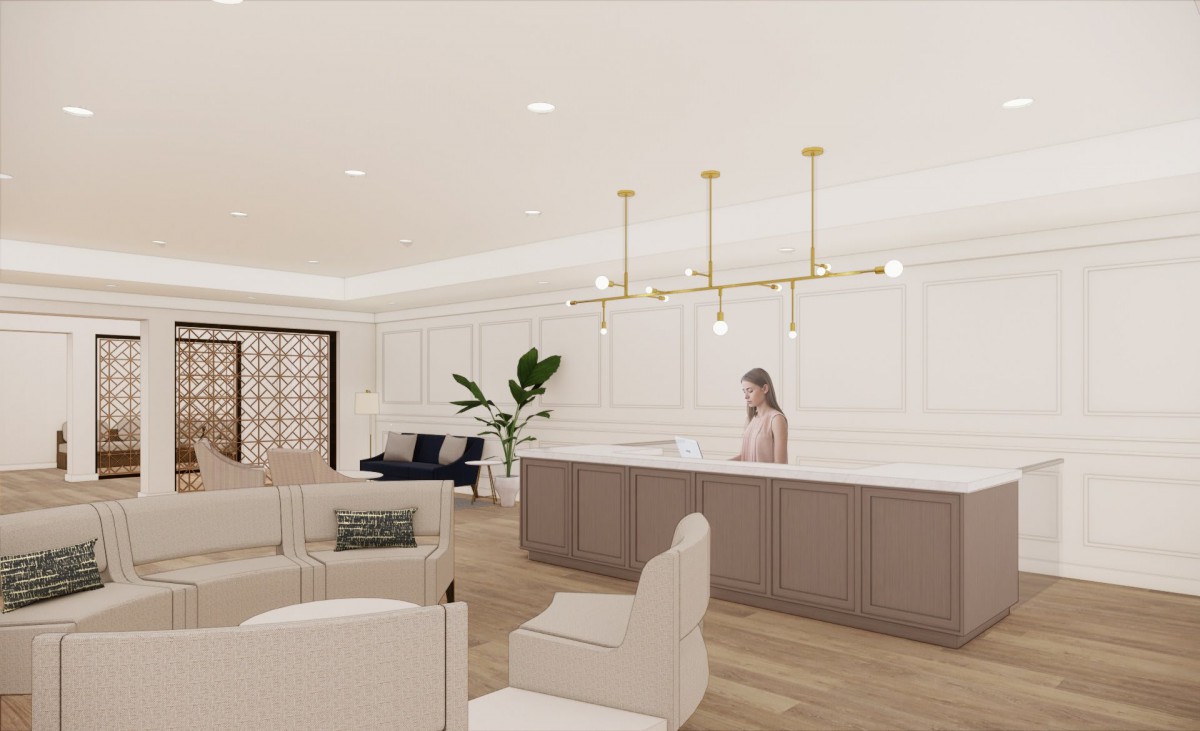 A modern reception area with neutral colors and minimalist design, featuring a lounge and a central chandelier.