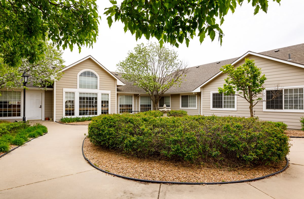 A suburban residential house with landscaped gardens.