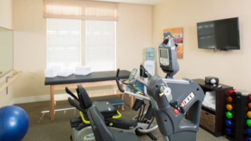 A well-equipped indoor gym featuring exercise machines.