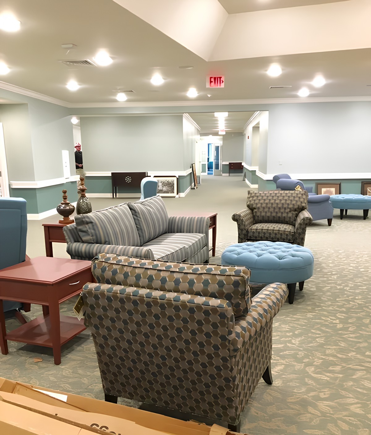 A spacious lobby with comfortable seating arrangements and elegant decor.