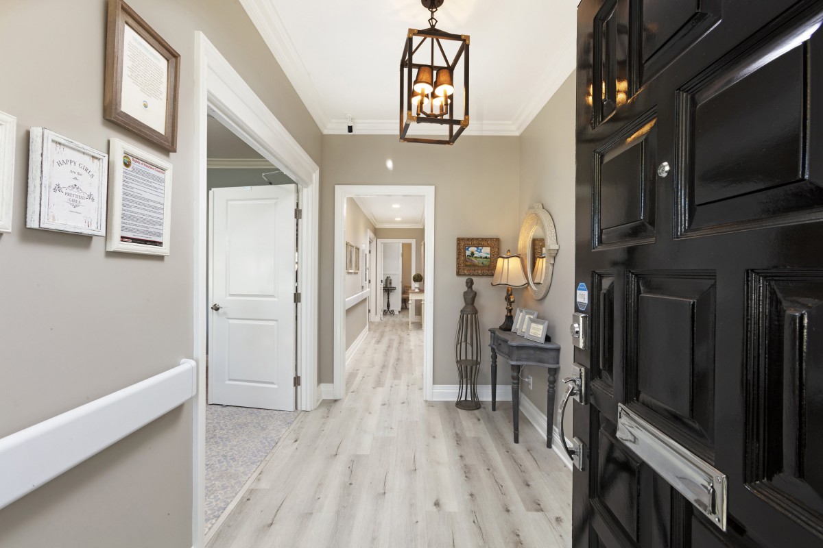 A stylish and welcoming home entrance with modern lighting and elegant decor.