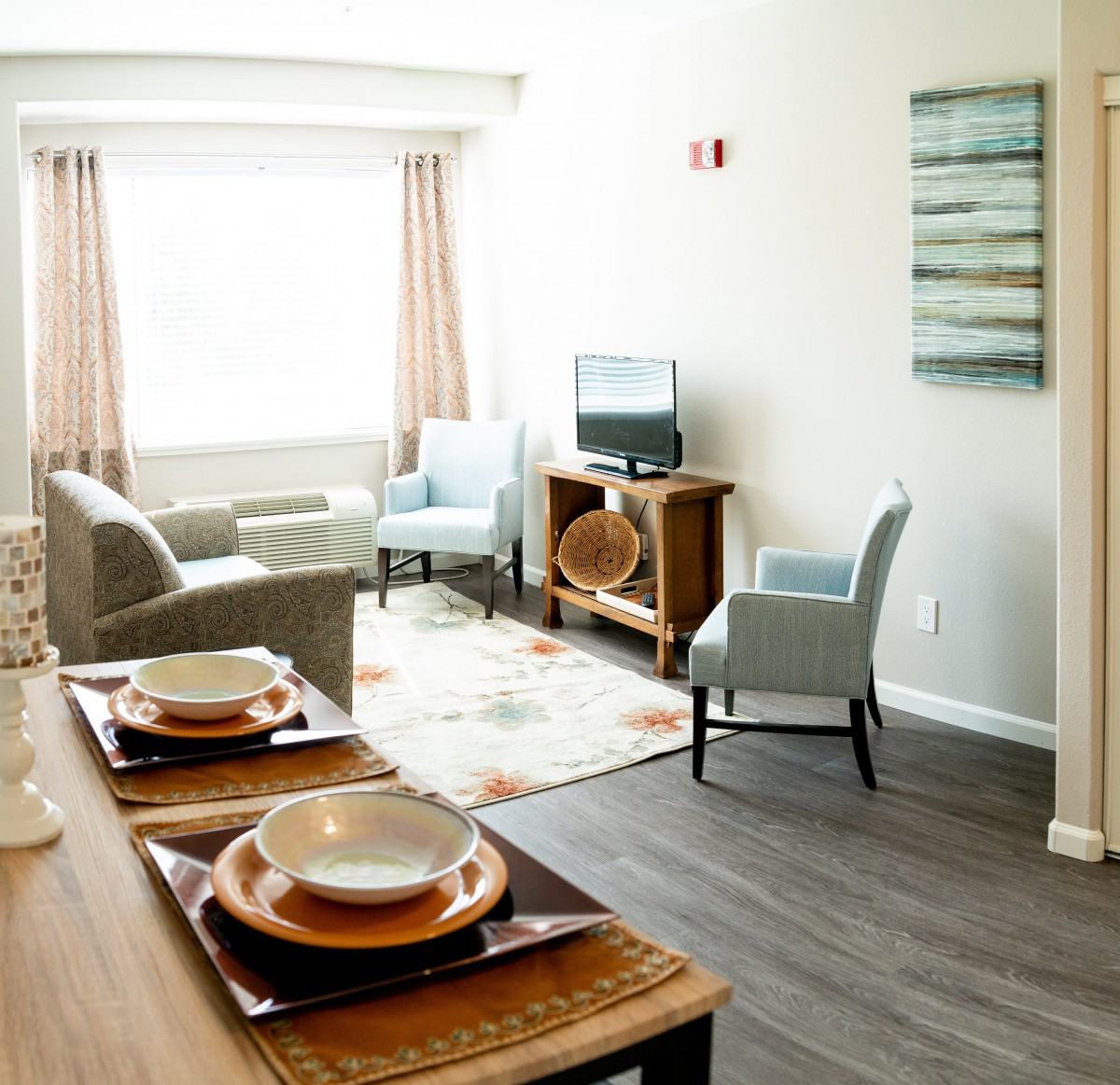 Modern living room with dining area and cozy seating.
