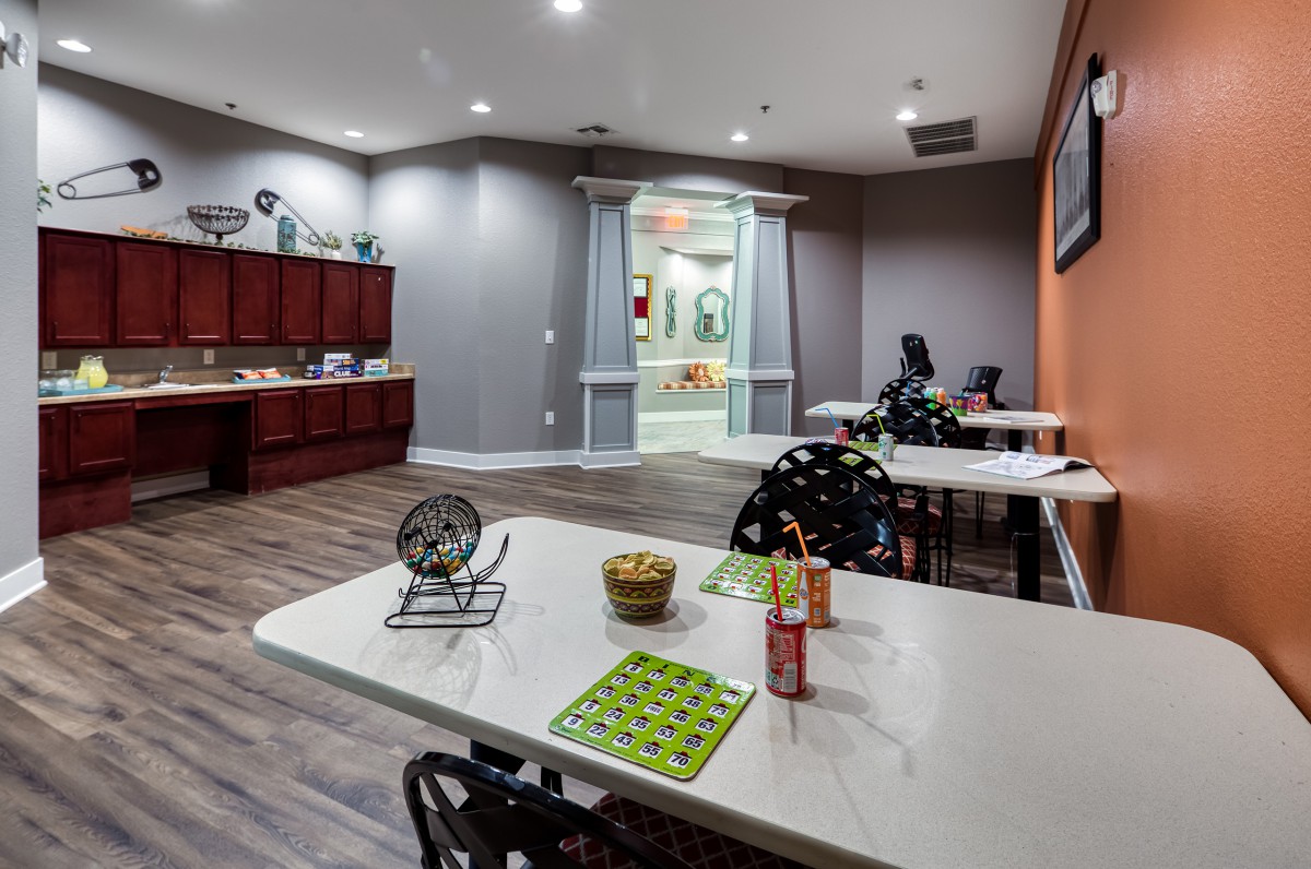 A cozy recreation room set up with tables for bingo games.