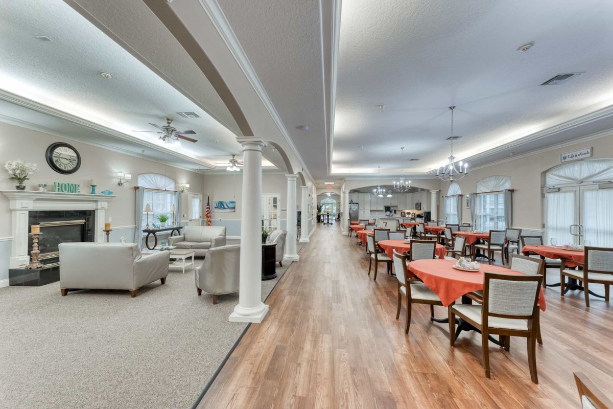 Spacious dining and lounge area with modern seating arrangements and ambient lighting.