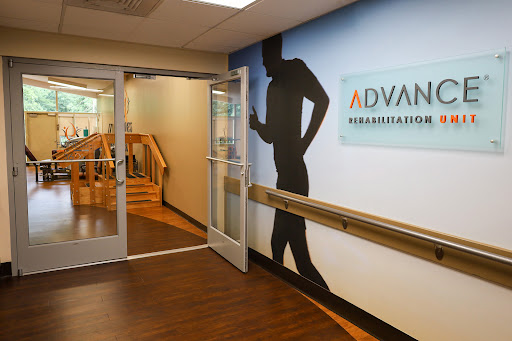 Entrance to a rehabilitation center featuring a dynamic silhouette on the wall.