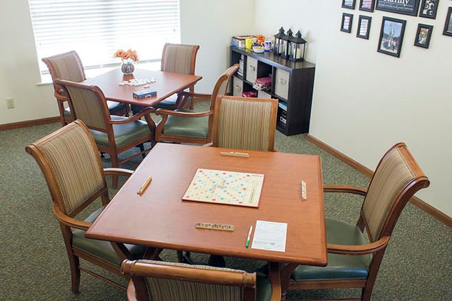 A cozy game room with tables set up for playing Scrabble.