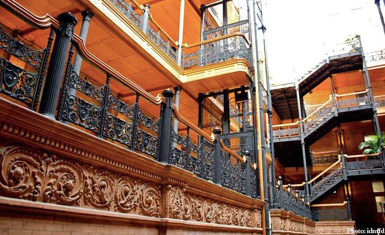 A historical building featuring intricate ironwork and ornate architectural details.