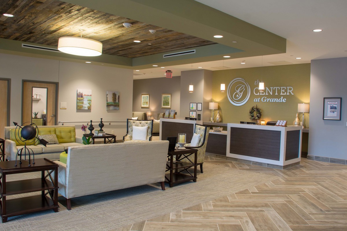 A modern reception and waiting area with contemporary decor and seating.