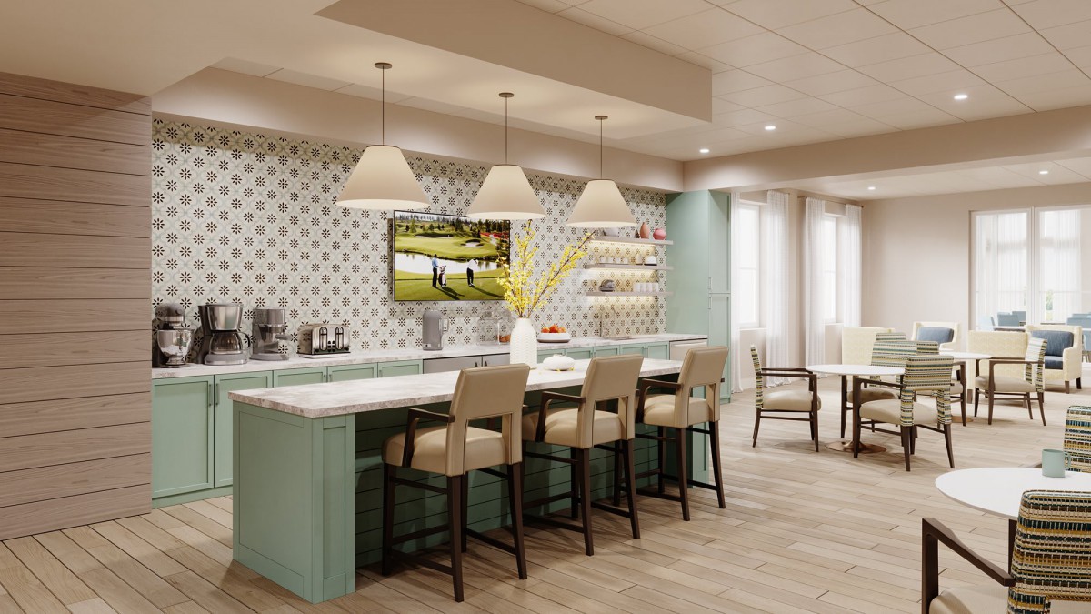 A modern kitchen with a stylish island, featuring pendant lights and bar stools.