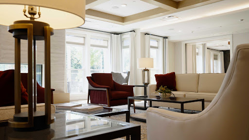 A stylish and inviting living room featuring modern furniture and abundant natural light.