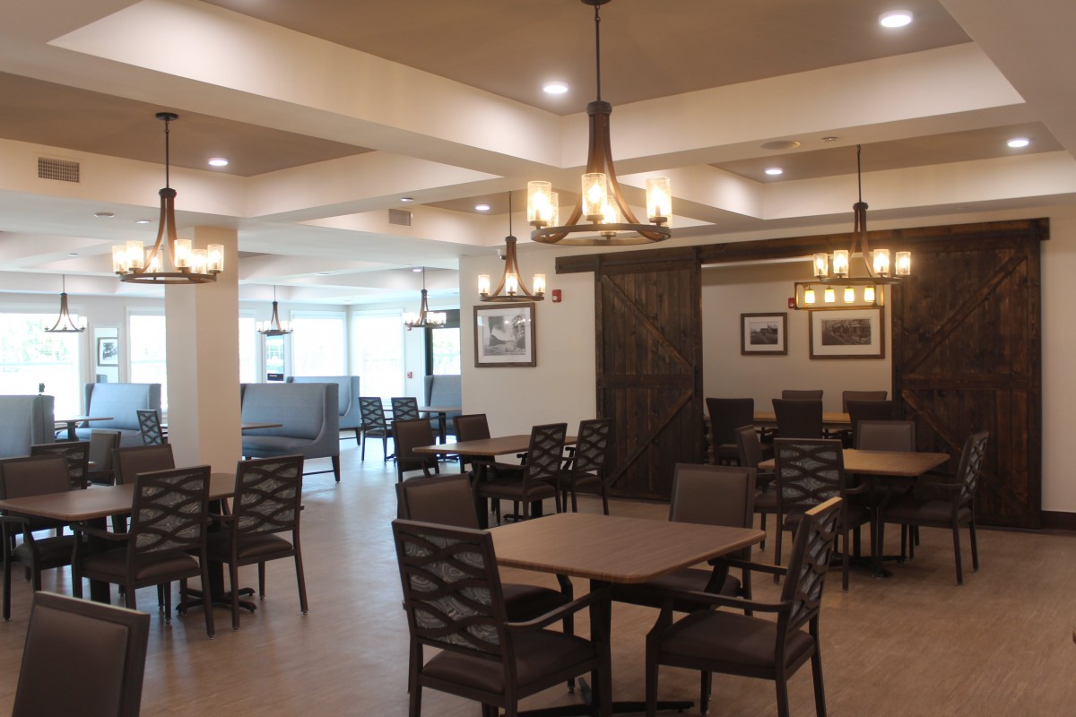 Spacious dining area with modern decor and ample seating.
