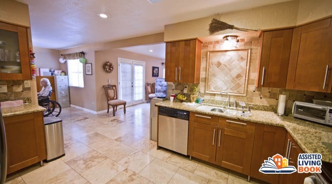 A modern kitchen with wooden cabinets and stainless steel appliances in an open layout.