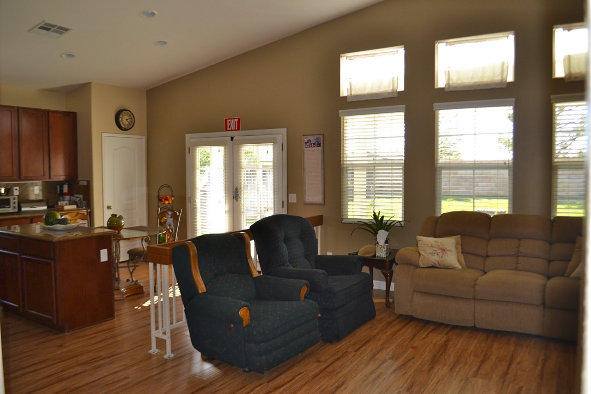 A cozy living room with comfortable seating and natural light.