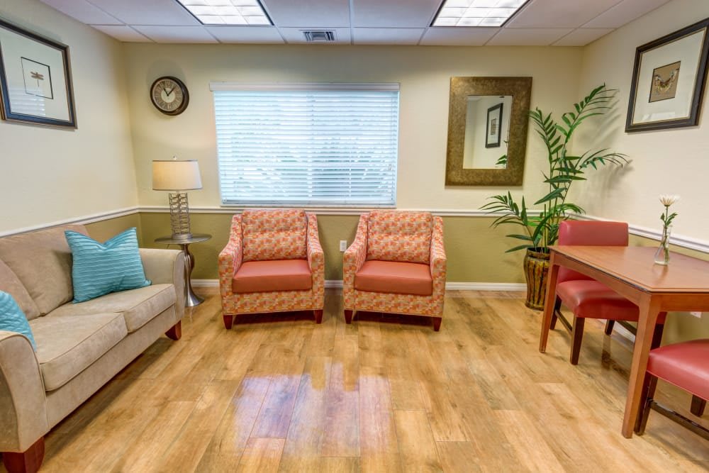A cozy waiting room with comfortable seating and warm decor.