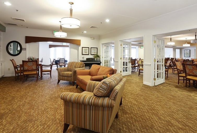 A cozy living room with comfortable seating and warm lighting.