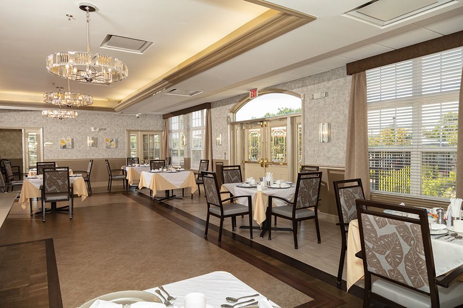 An elegant restaurant dining area with neatly arranged tables and chairs.