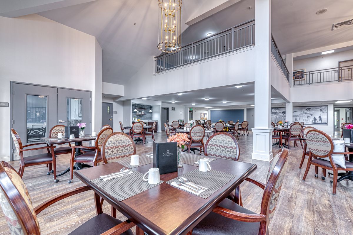 A modern, spacious dining area with elegant decor and ample seating.