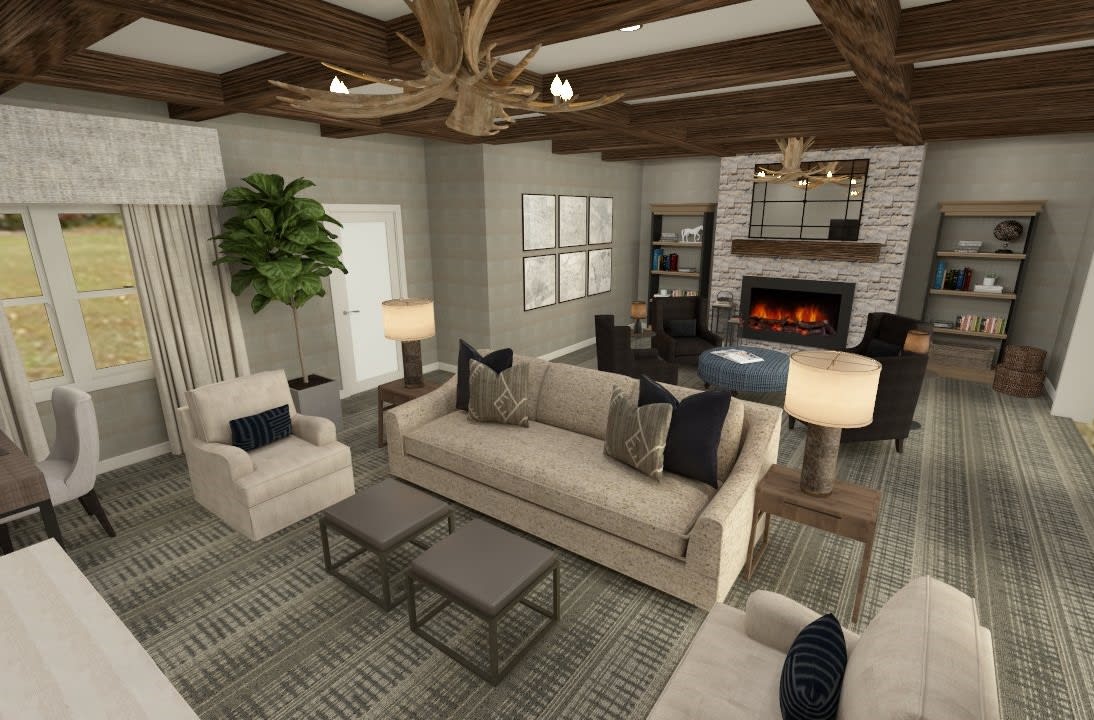 A modern living room with neutral colors, featuring a cozy sofa, armchairs, and a fireplace under wooden ceiling beams.