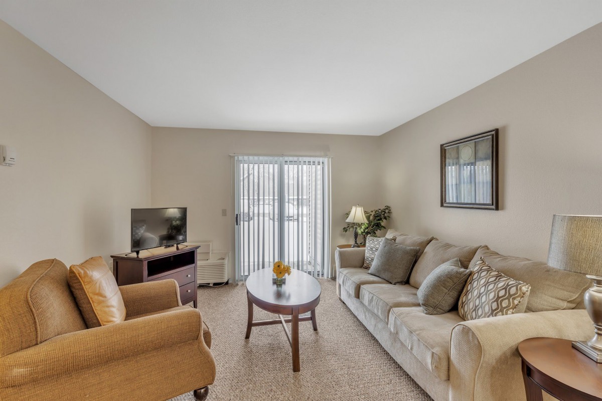 A cozy living room with comfortable seating and natural light.