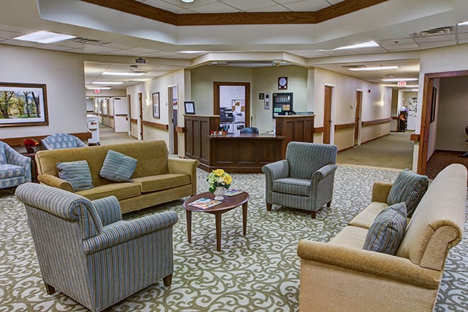 A welcoming lobby area with comfortable seating and a reception desk.