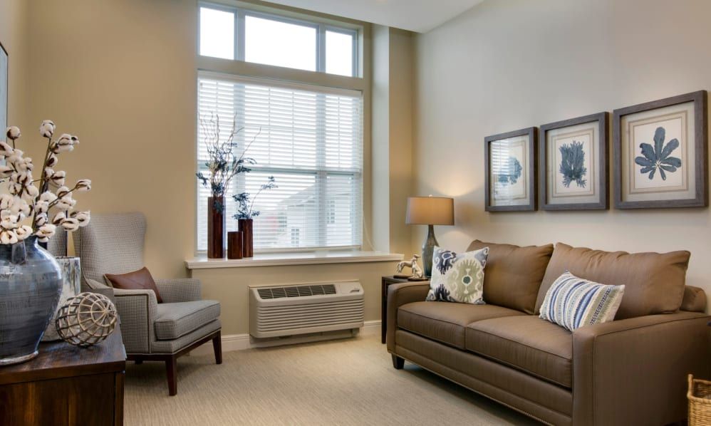 A cozy living room with neutral tones and stylish decor.