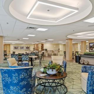 Modern lobby with comfortable seating and decorative plants.