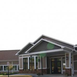 A modern building with a prominent entrance and clean architectural lines.