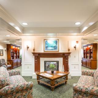 A cozy living room with comfortable seating and a fireplace.