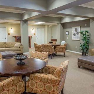 A spacious living area with comfortable seating and elegant decor.