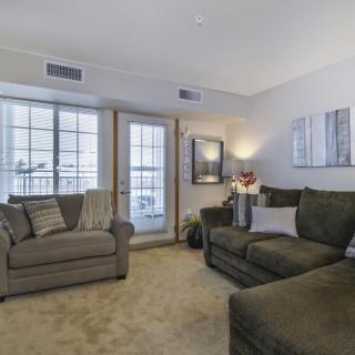 A cozy living room with comfortable sofas and soft lighting.