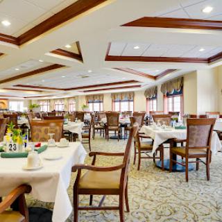 An elegant dining area featuring well-arranged tables and comfortable seating, perfect for a pleasant meal.