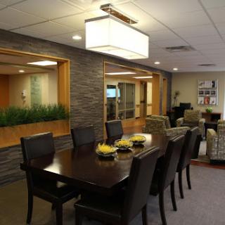 A stylish dining area featuring modern furnishings and ambient lighting.