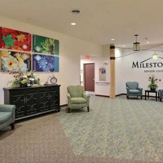 A welcoming lobby area with comfortable seating and colorful artwork on the wall.