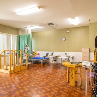 A spacious therapy room equipped for rehabilitation activities.