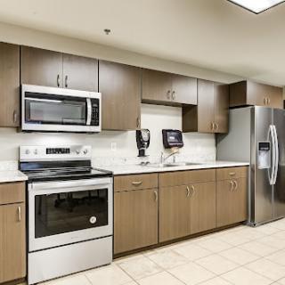 A modern kitchen featuring stainless steel appliances and sleek cabinetry.