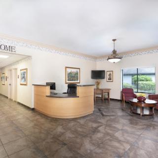 A welcoming reception area featuring a front desk and seating arrangements.