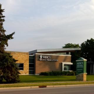 A modern healthcare facility with a well-maintained landscape.
