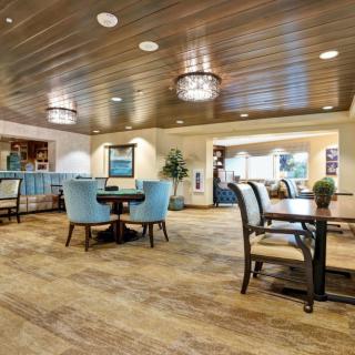 A modern dining area with elegant seating and warm lighting.