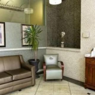 A modern waiting area with comfortable seating and decorative elements.