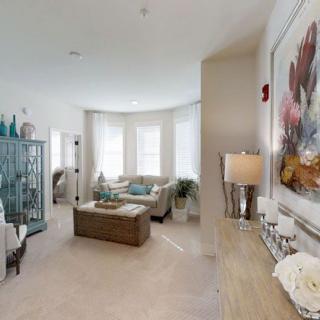 A cozy and stylish living room with modern furniture and decorative elements.