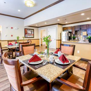 A well-decorated dining area with a neatly set table in a cozy interior.
