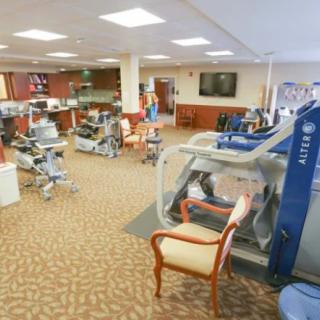 A rehabilitation clinic featuring various therapy and exercise equipment.