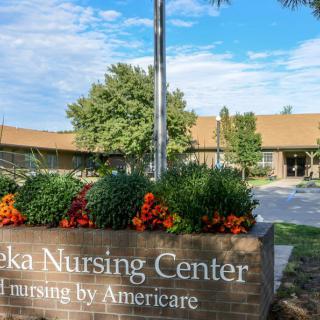 Front view of Eureka Nursing Center with Americare signage and landscaping.