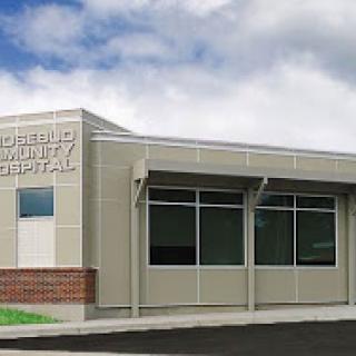 A modern healthcare facility with large windows and a welcoming entrance.