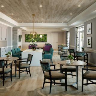 A modern dining area with stylish furniture and elegant lighting.