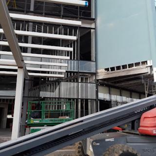 A view of an ongoing construction site showcasing the framework and interior structure of a modern building.