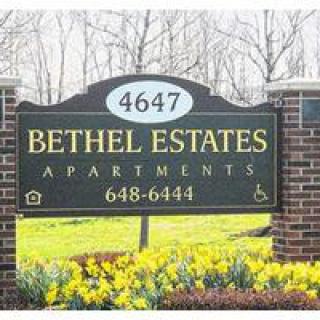 Sign for Bethel Estates Apartments displaying address and contact information.